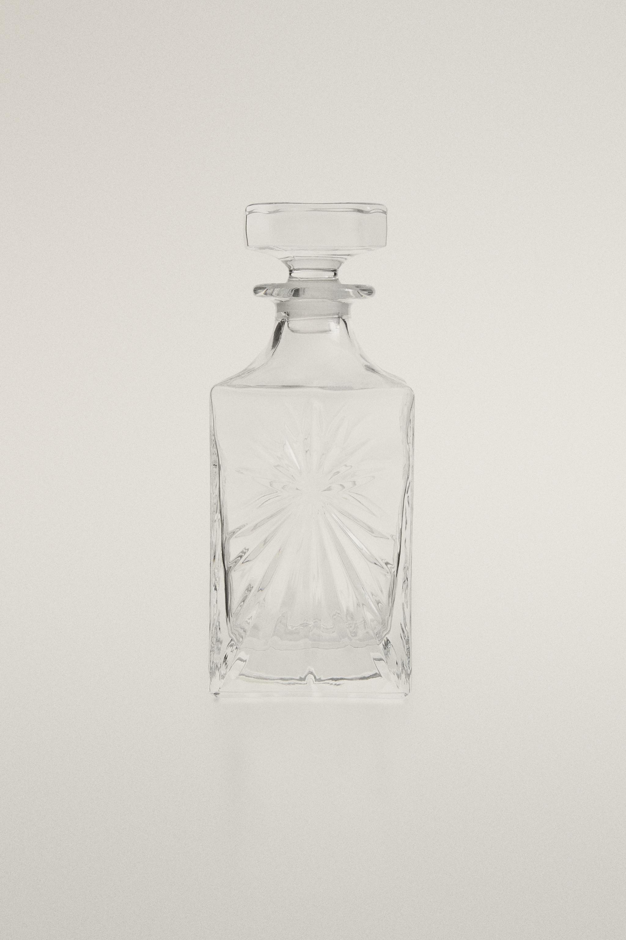 CRYSTALLINE BOTTLE WITH RAISED DESIGN